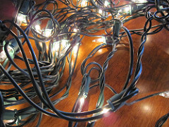 A mass Christmas lights, tangled like egg proteins